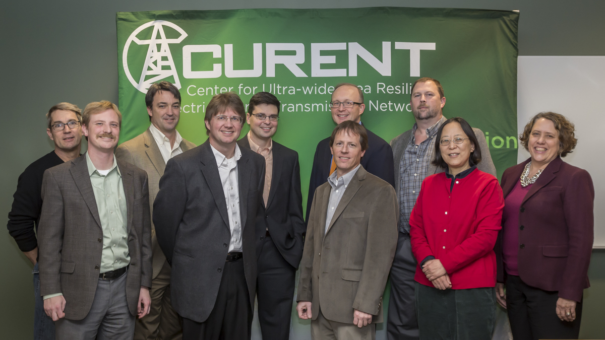 Group portrait of Curent and Powermetrix teams.